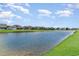 Scenic view of a tranquil pond surrounded by lush green lawns at 567 Hickman St., Surfside Beach, SC 29575