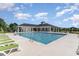 Community pool with lounge chairs and covered patio for relaxing in the sun at 567 Hickman St., Surfside Beach, SC 29575