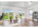 Well-lit sun room with views of the backyard pond and a cozy seating area at 567 Hickman St., Surfside Beach, SC 29575