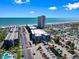 Aerial view showcasing resorts by the ocean, parking lots, and water features at 5905 South Kings Hwy. # 131B, Myrtle Beach, SC 29575