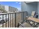 Relaxing balcony featuring chairs, table, and a view of the parking and neighboring buildings at 5905 South Kings Hwy. # 131B, Myrtle Beach, SC 29575