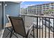 View from balcony showing outdoor seating and view of the parking lot at 5905 South Kings Hwy. # 131B, Myrtle Beach, SC 29575