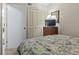 Cozy bedroom featuring closet, mirror, and floral bedding in a comfortable space at 5905 South Kings Hwy. # 131B, Myrtle Beach, SC 29575