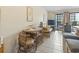 Inviting living area with tiled floors, casual seating, and sliding doors to balcony at 5905 South Kings Hwy. # 131B, Myrtle Beach, SC 29575