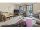 Cozy living room featuring comfortable seating, a TV, and access to a private balcony with views at 5905 South Kings Hwy. # 131B, Myrtle Beach, SC 29575