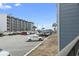 View of parking lot in front of buildings on a sunny day under a partly cloudy blue sky at 5905 South Kings Hwy. # 131B, Myrtle Beach, SC 29575