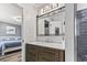 Stylish bathroom with a modern vanity, large mirror, and view into bedroom at 605 62Nd Ave. N, Myrtle Beach, SC 29572