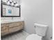 Modern bathroom with floating vanity, and sleek fixtures, offering a clean and stylish space with a contemporary feel at 605 62Nd Ave. N, Myrtle Beach, SC 29572