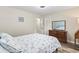 Cozy bedroom featuring a dresser, carpet, and soothing natural light, creating a tranquil and inviting atmosphere at 605 62Nd Ave. N, Myrtle Beach, SC 29572