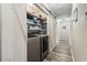Functional laundry area with washer, dryer, barn doors, and built-in shelving, blending convenience with stylish design at 605 62Nd Ave. N, Myrtle Beach, SC 29572