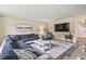 Spacious living room featuring a comfortable sectional sofa, a large TV, and stylish decor at 605 62Nd Ave. N, Myrtle Beach, SC 29572