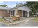 Outdoor patio area with a dining table and views of the surrounding greenery at 605 62Nd Ave. N, Myrtle Beach, SC 29572