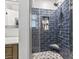 Tiled walk-in shower featuring a built-in niche and hexagon-tiled floor at 605 62Nd Ave. N, Myrtle Beach, SC 29572