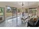 Bright sunroom with screened windows, casual seating, and view of the backyard at 605 62Nd Ave. N, Myrtle Beach, SC 29572