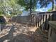 Fenced backyard with a gravel area and mature trees at 607 A 28Th Ave. S, North Myrtle Beach, SC 29582
