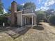Two-story home with a balcony, well-manicured yard, and inviting entrance at 607 A 28Th Ave. S, North Myrtle Beach, SC 29582