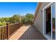 Spacious outdoor deck area with wooden railing and trees at 607 A 28Th Ave. S, North Myrtle Beach, SC 29582