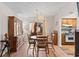 Dining room with wooden furniture, decorative lighting, and view to kitchen at 607 A 28Th Ave. S, North Myrtle Beach, SC 29582