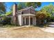 Charming two-story home featuring a brick chimney, balcony, and inviting front entrance at 607 A 28Th Ave. S, North Myrtle Beach, SC 29582