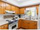 Bright kitchen with wood cabinets, stainless appliances, and a double basin sink at 607 A 28Th Ave. S, North Myrtle Beach, SC 29582