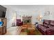 Bright living room featuring a brick fireplace and leather furniture set at 607 A 28Th Ave. S, North Myrtle Beach, SC 29582
