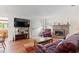 Bright living room featuring a fireplace and leather furniture set at 607 A 28Th Ave. S, North Myrtle Beach, SC 29582