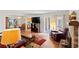 Cozy living room with a fireplace, wood floors, and an open floor plan at 607 A 28Th Ave. S, North Myrtle Beach, SC 29582
