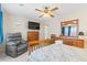 Cozy main bedroom with wood furniture, recliner, and mounted tv at 607 A 28Th Ave. S, North Myrtle Beach, SC 29582