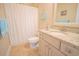 Well-lit bathroom featuring a granite countertop, vanity, and shower with tasteful beach decor at 625 Whispering Pines Ct., Murrells Inlet, SC 29576