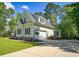 Beautiful home with a two-car garage, well-maintained landscaping, and a spacious driveway at 625 Whispering Pines Ct., Murrells Inlet, SC 29576
