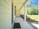 Inviting front porch features a covered entrance, decorative railings, and space for seating at 625 Whispering Pines Ct., Murrells Inlet, SC 29576