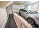 A spacious two-car garage featuring an automatic door and a silver SUV, providing ample space for parking and storage at 625 Whispering Pines Ct., Murrells Inlet, SC 29576
