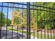 A wrought iron gate with gold lettering at Bellwood Landing offers a grand entrance to the neighborhood at 625 Whispering Pines Ct., Murrells Inlet, SC 29576