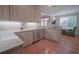 Modern kitchen with granite countertops, stainless steel appliances, and hardwood floors at 625 Whispering Pines Ct., Murrells Inlet, SC 29576