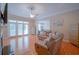 Bright living room with hardwood floors, ample seating, and access to the patio at 625 Whispering Pines Ct., Murrells Inlet, SC 29576