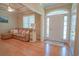 Cozy living room featuring hardwood floors, neutral paint, and a stylish couch at 625 Whispering Pines Ct., Murrells Inlet, SC 29576