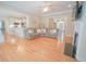 Spacious living room with hardwood floors, an open layout, and a cozy fireplace at 625 Whispering Pines Ct., Murrells Inlet, SC 29576