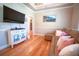 Inviting living room with hardwood floors, a comfortable couch, and a decorative cabinet at 625 Whispering Pines Ct., Murrells Inlet, SC 29576