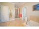 Relaxing main bathroom with tub and separate glass shower at 625 Whispering Pines Ct., Murrells Inlet, SC 29576