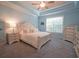 Light-filled main bedroom with tray ceiling and neutral decor at 625 Whispering Pines Ct., Murrells Inlet, SC 29576