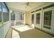 Inviting screened-in porch with a ceiling fan, offering a serene space for outdoor relaxation at 625 Whispering Pines Ct., Murrells Inlet, SC 29576