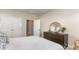 Cozy bedroom featuring a large bed, dresser with round mirror, and ample closet space at 631 Fair Feather Ct., Myrtle Beach, SC 29588
