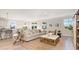 Bright living room with neutral decor, hardwood floors, and plenty of natural light at 631 Fair Feather Ct., Myrtle Beach, SC 29588