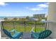 Balcony with ocean views, seating and overlooking a pool at 645 Retreat Beach Circle # A-2-C, Pawleys Island, SC 29585