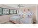 Bright bedroom features two beds with decorative coral-themed pillows, complemented by a window view at 645 Retreat Beach Circle # A-2-C, Pawleys Island, SC 29585