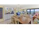 Dining area open to living space with ocean views at 645 Retreat Beach Circle # A-2-C, Pawleys Island, SC 29585