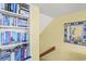 Hallway with book shelves, stairs and a decorative mirror at 645 Retreat Beach Circle # A-2-C, Pawleys Island, SC 29585