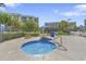 Community hot tub surrounded by lounge furniture and landscaping, adjacent to residential buildings at 645 Retreat Beach Circle # A-2-C, Pawleys Island, SC 29585