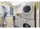 This laundry room includes a washer and dryer and storage at 645 Retreat Beach Circle # A-2-C, Pawleys Island, SC 29585