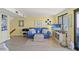 Comfortable living room with tv, coastal decor, and natural light at 645 Retreat Beach Circle # A-2-C, Pawleys Island, SC 29585
